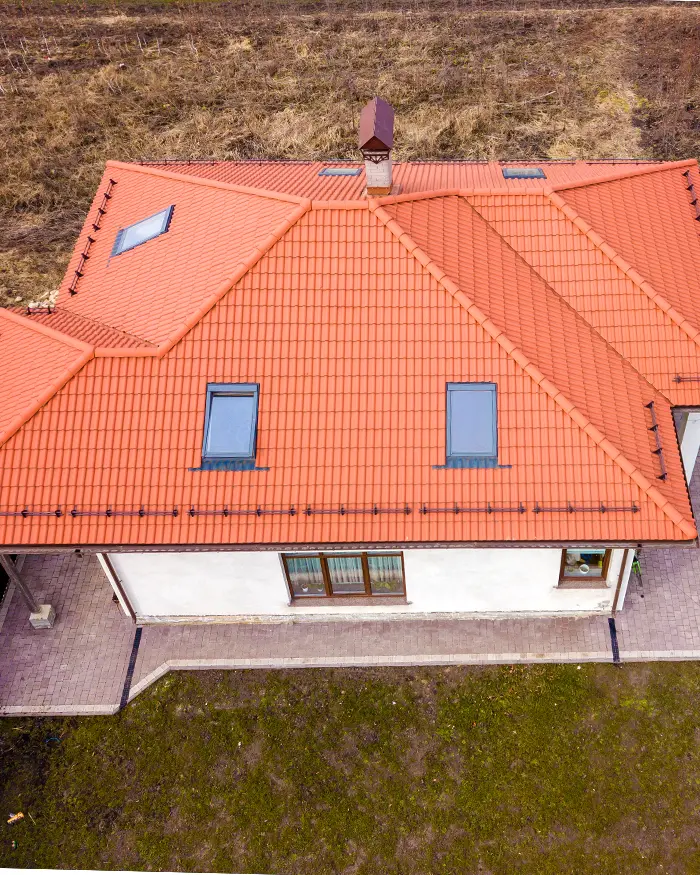 Aerial top view of house metal shingle roof