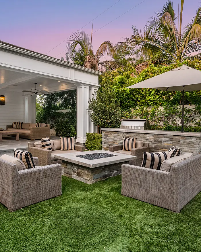 outdoor patio and living are in the backyard
