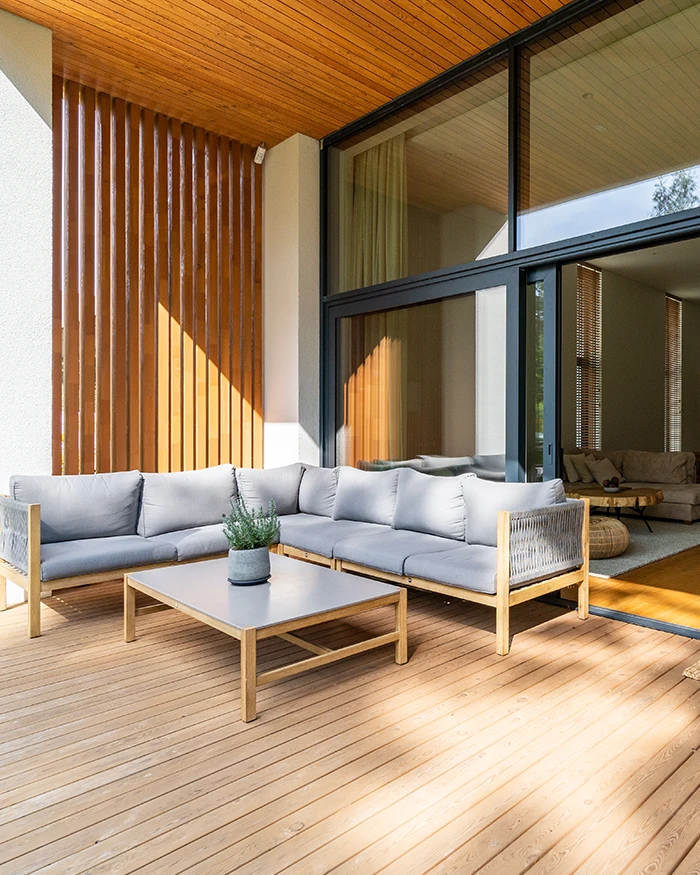outdoor wooden deck with sofa and table